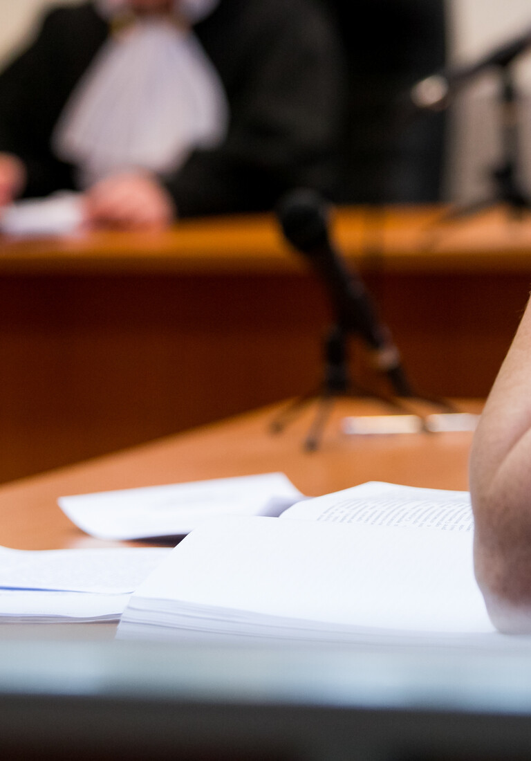 Lawyers listening to the judge in the court room