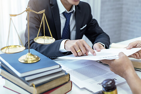 Businessman and lawyer going over documents