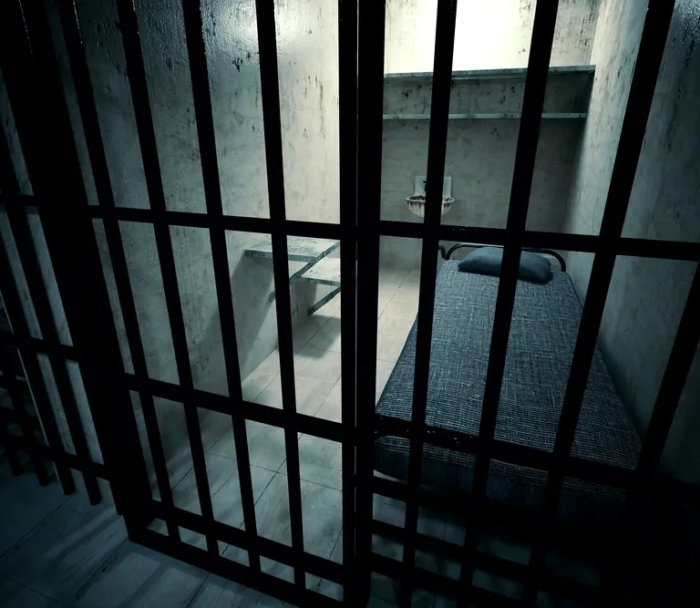An empty jail cell.