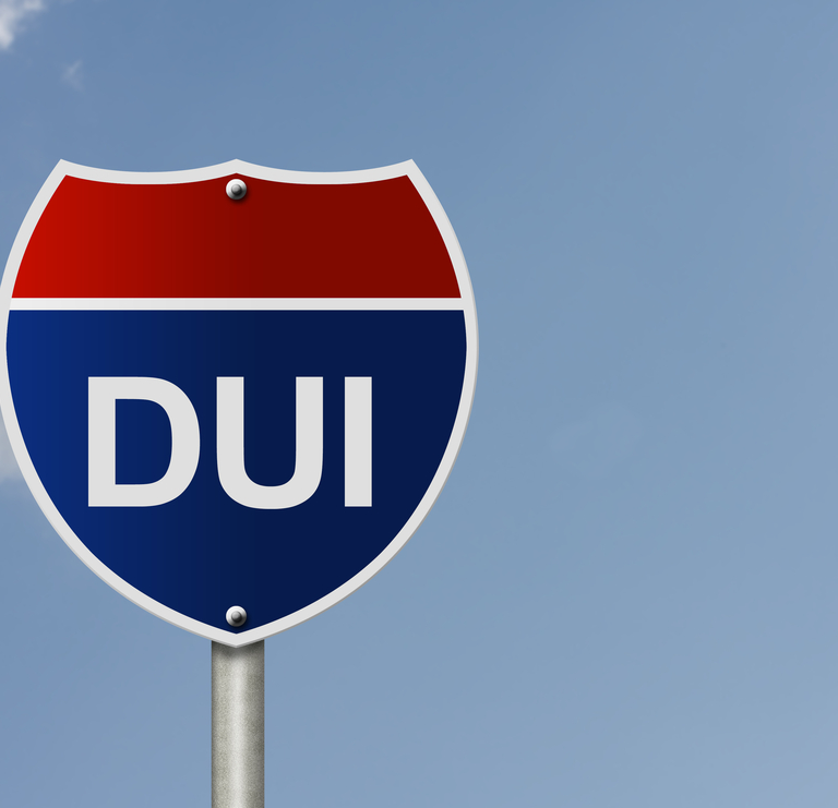 A street sign with DUI across it.