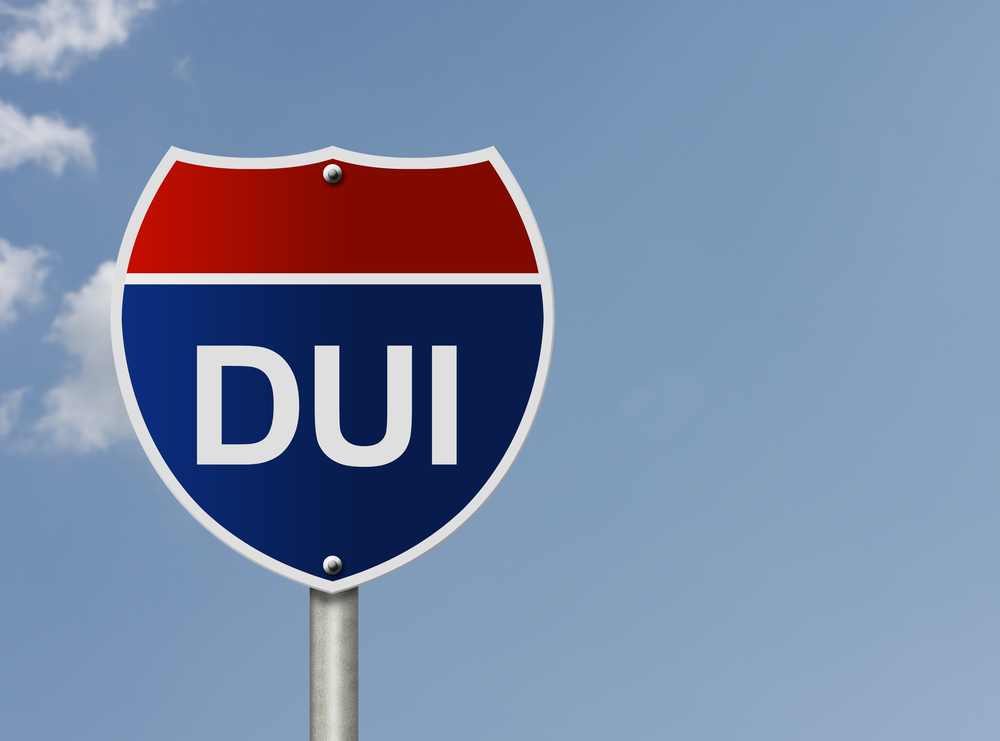 A street sign with DUI across it.